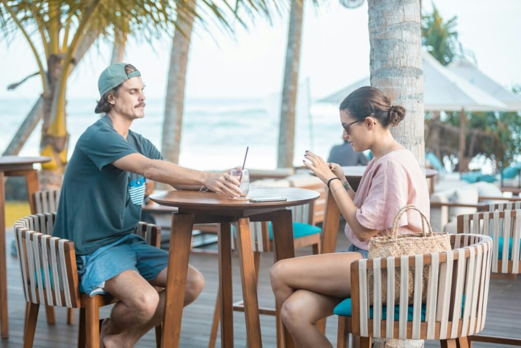 Couple enjoying a beachside café table in Sri Lanka