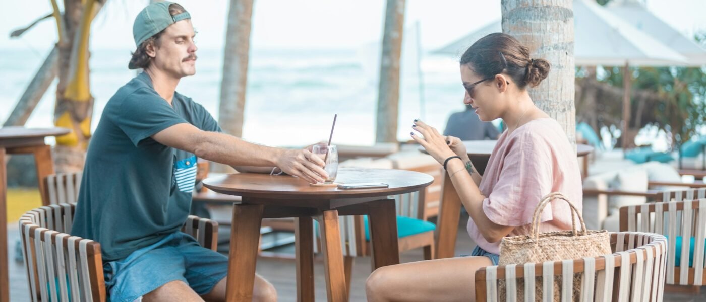 Couple enjoying a beachside café table in Sri Lanka