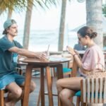 Couple enjoying a beachside café table in Sri Lanka